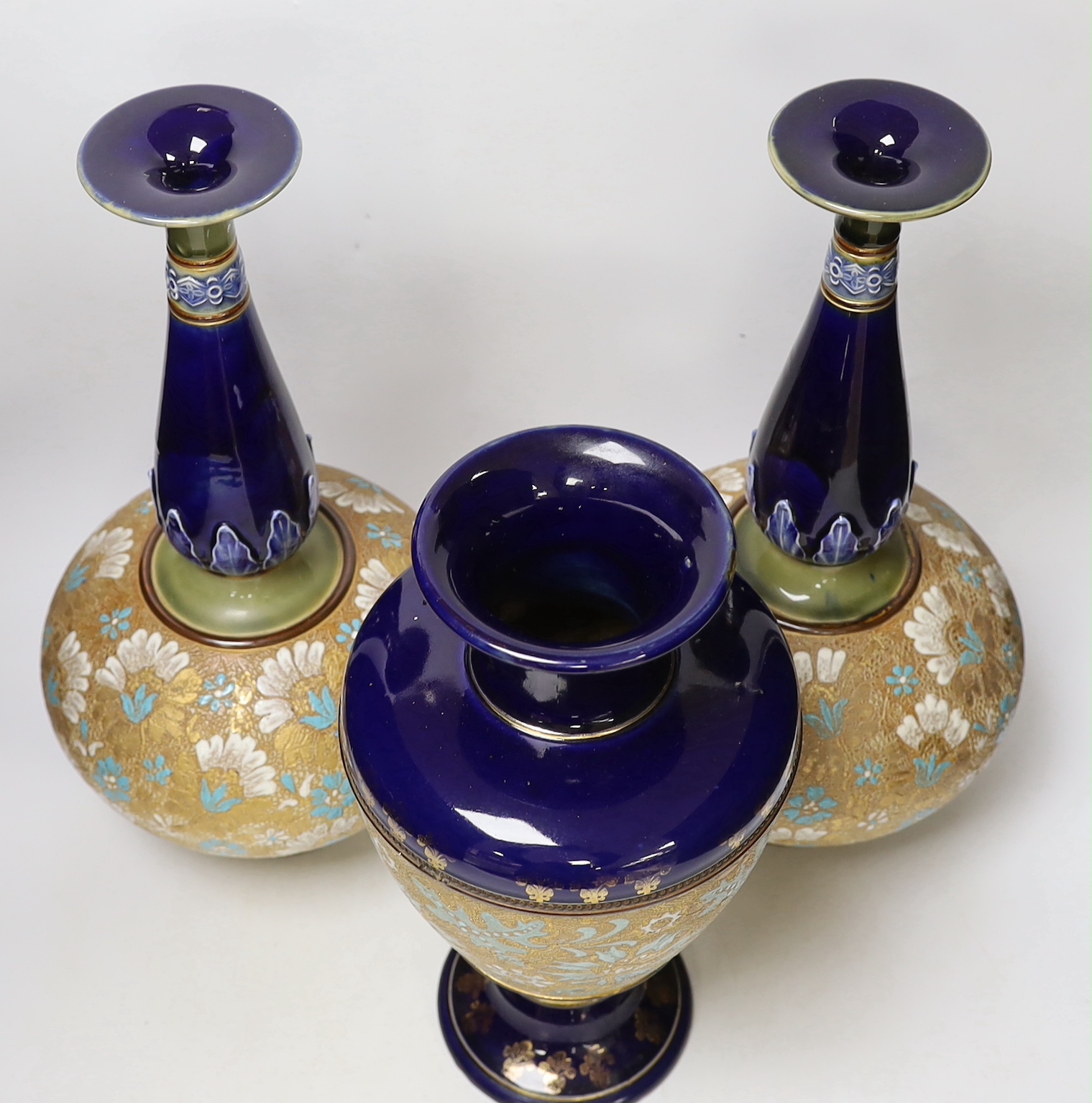 A pair of Royal Doulton Lambeth Slaters patent bottle vases and another similar vase, 41cm